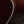 Close-up of a wooden acoustic guitar with a dark finish