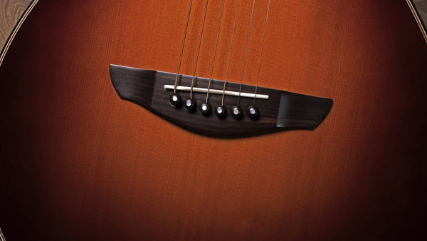 Close-up of an acoustic guitar's soundhole and strings