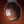 Close-up of an acoustic guitar's soundhole with a label on a dark background