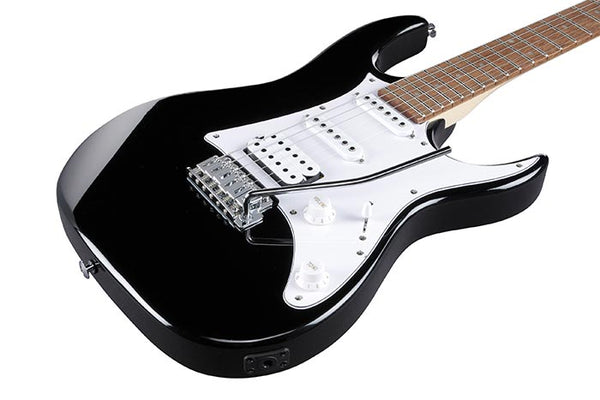 Black electric guitar on a white background
