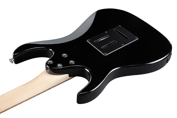 Black electric guitar on a white background